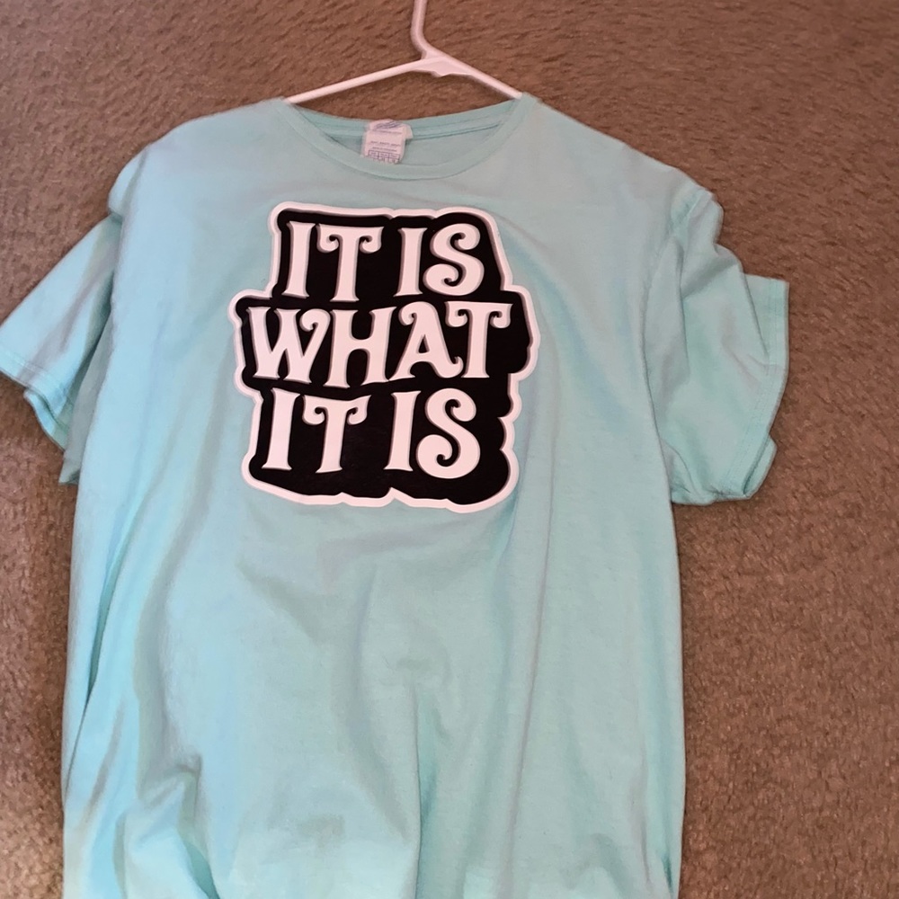 This is a teal oversized shirt made with 100% cotton